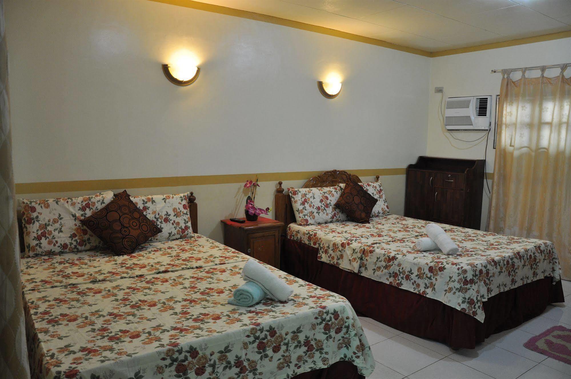 D'Lucky Garden Inn & Suites Tiniguiban Bagian luar foto